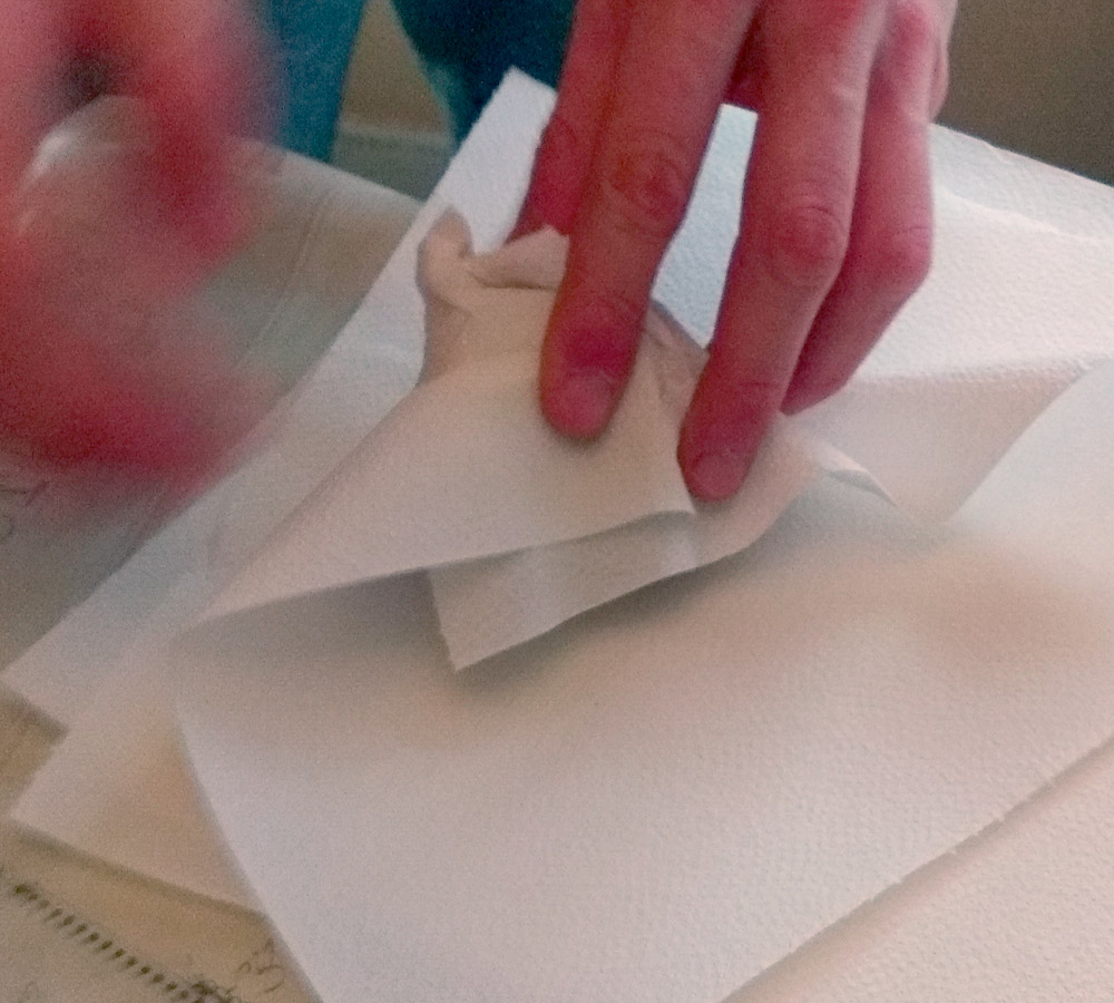 Wrapping the truffles in paper, one at a time.